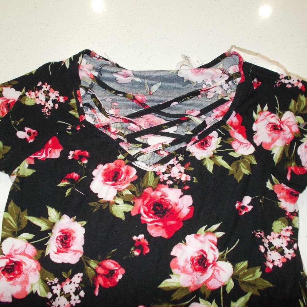 Black top with open front, bright pink and red flowers